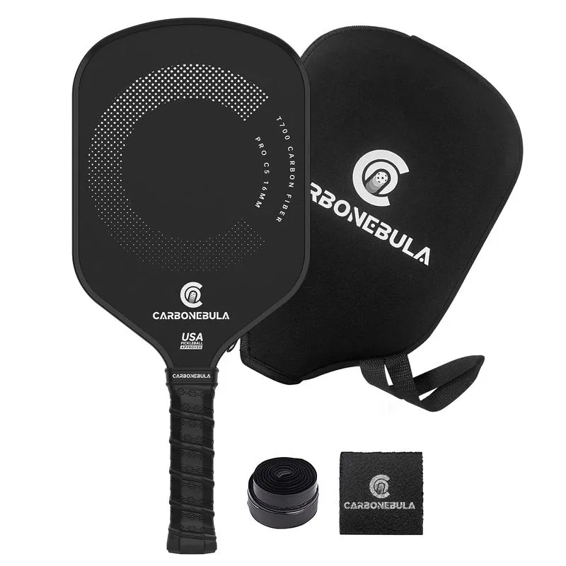 Carbonebula Pro C5 paddle resting next to a bucket of outdoor pickleballs